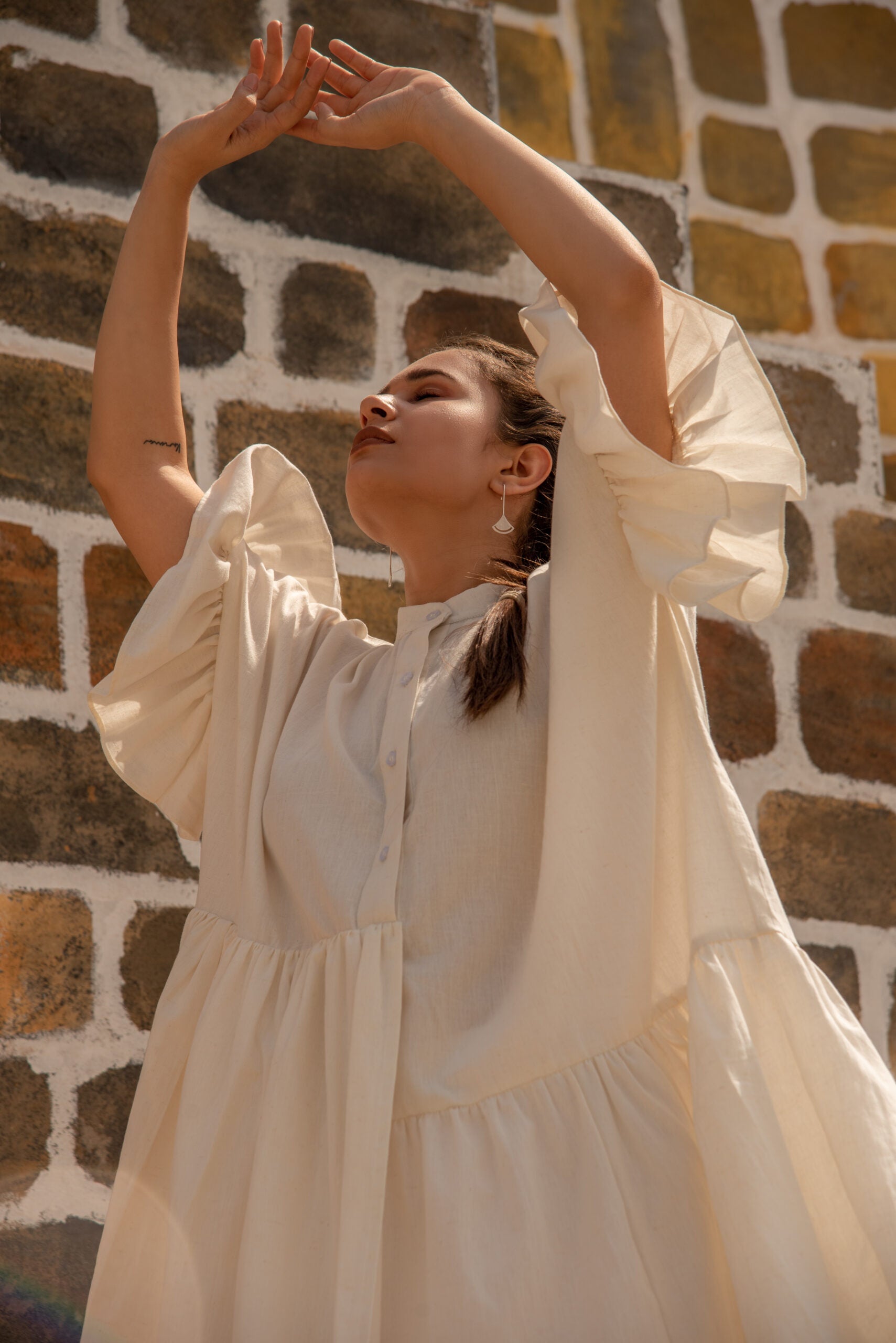 Elegant white summer dress for women with puffy sleeves and a relaxed fit, perfect for sunny days