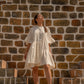 Chic white summer dress for women with ruffled sleeves, perfect for casual outings