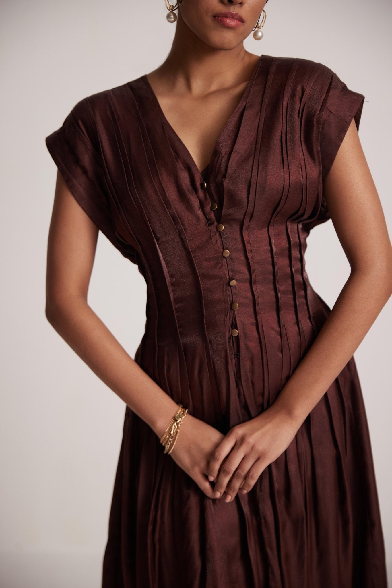 Stylera wine red v neck dress with button details and pleated design on model