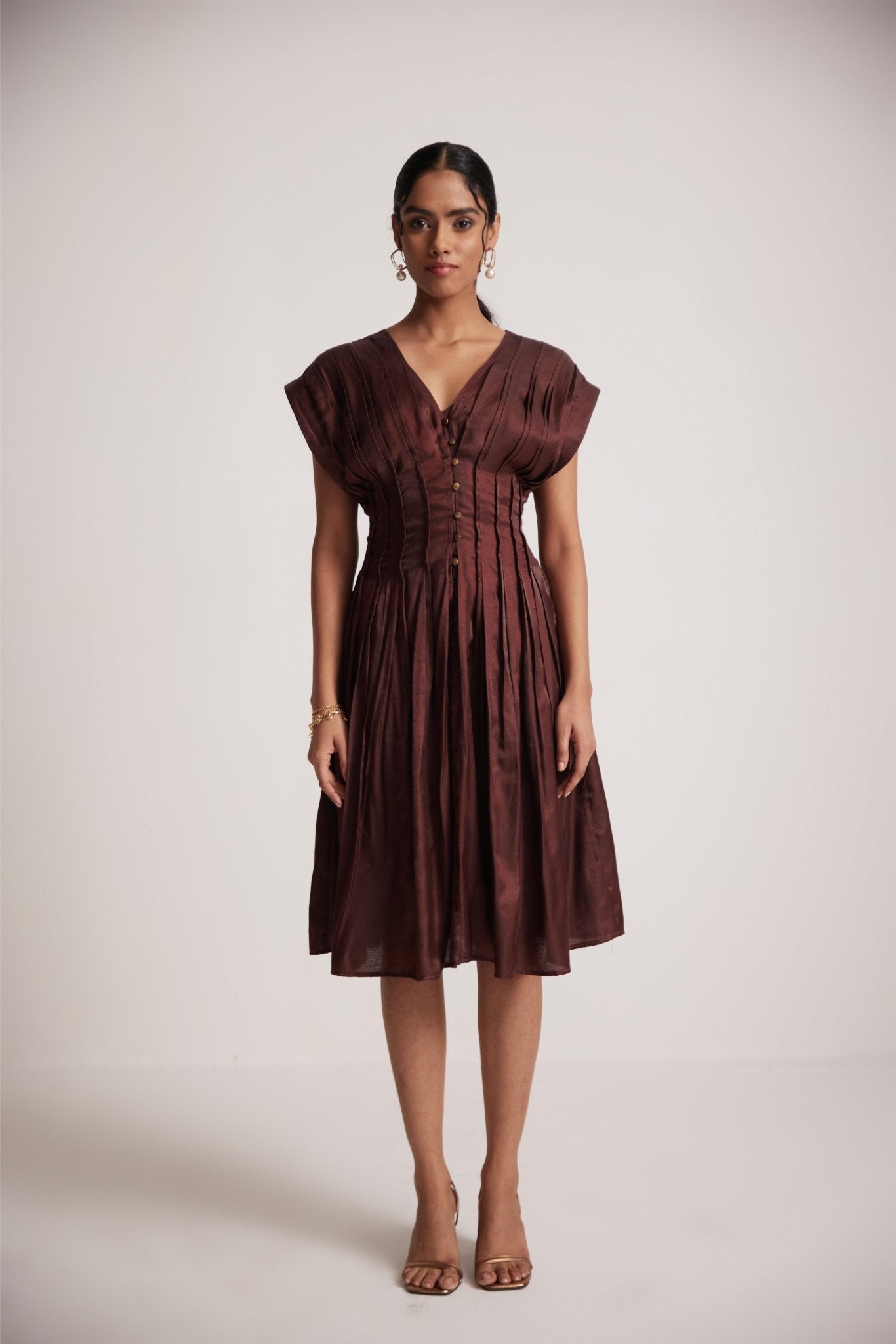Stylera wine red v neck dress with pleated skirt and buttoned front worn by model