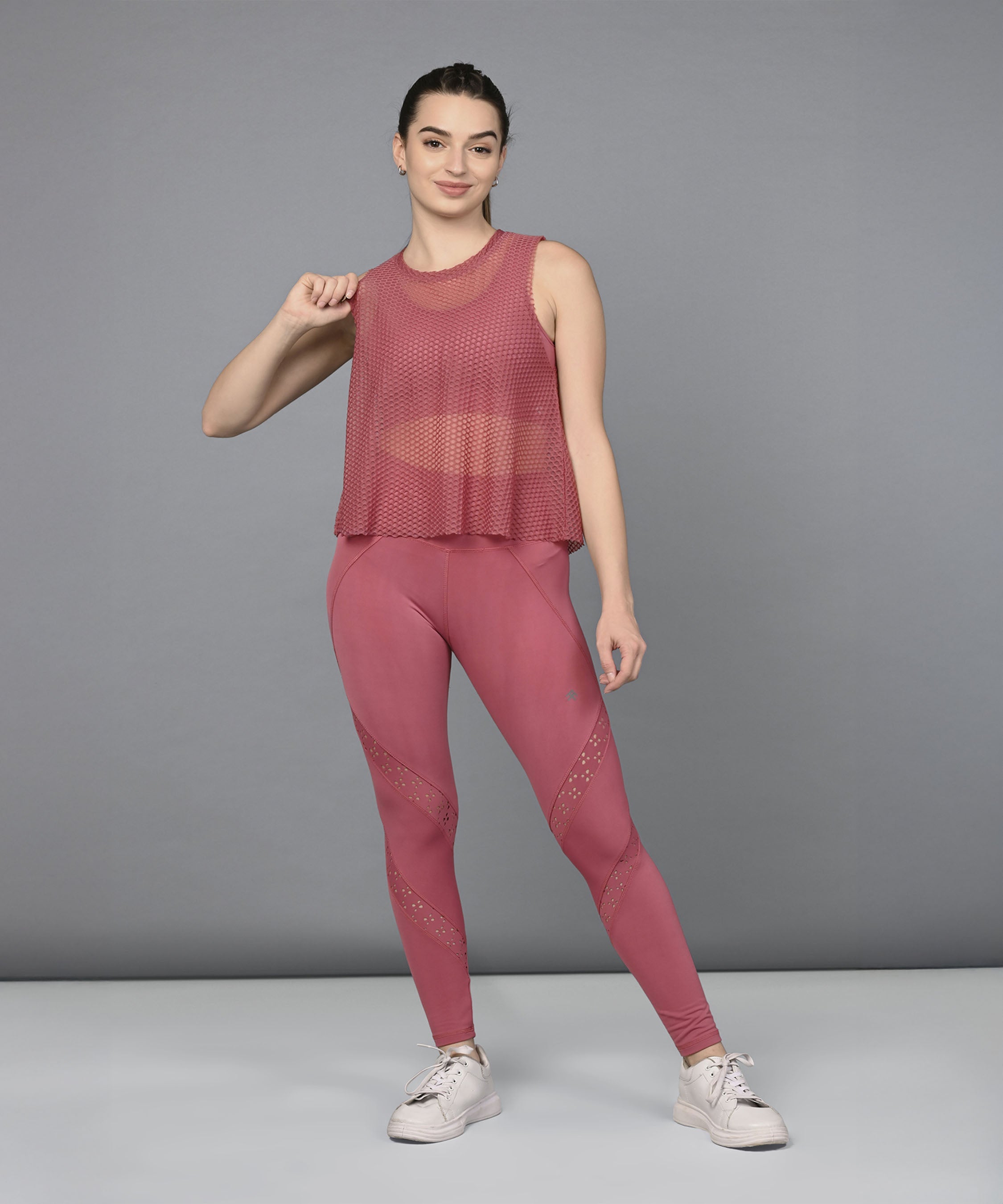 Stylish women's mesh workout top in rose pink, perfect for activewear and gym sessions