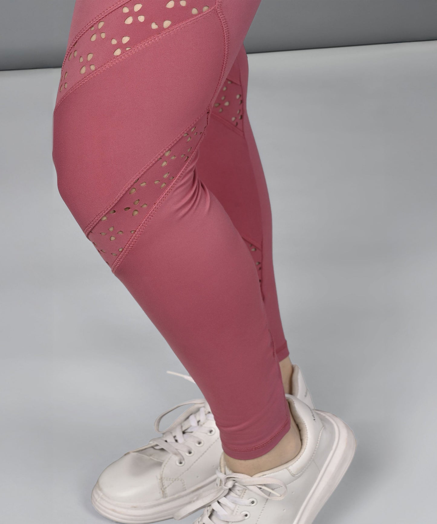 Stylera women's mesh workout top paired with stylish pink leggings and white sneakers