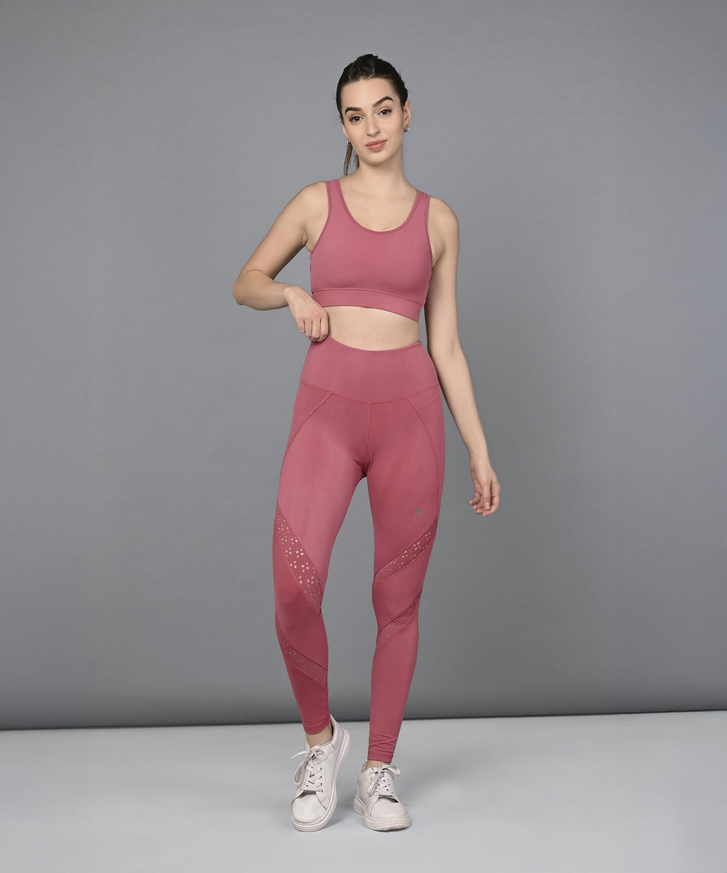 Stylera women's mesh workout top in pink paired with coordinating leggings for stylish training