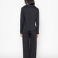 Stylera women's black wide leg trousers shown from the back worn with a black long sleeve top