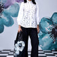 Model wearing Stylera women's casual chic white shirt with lace front and balloon sleeves
