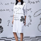 Stylera white knee-length women’s casual shirt dress with print black handwritten motifs and clover detail
