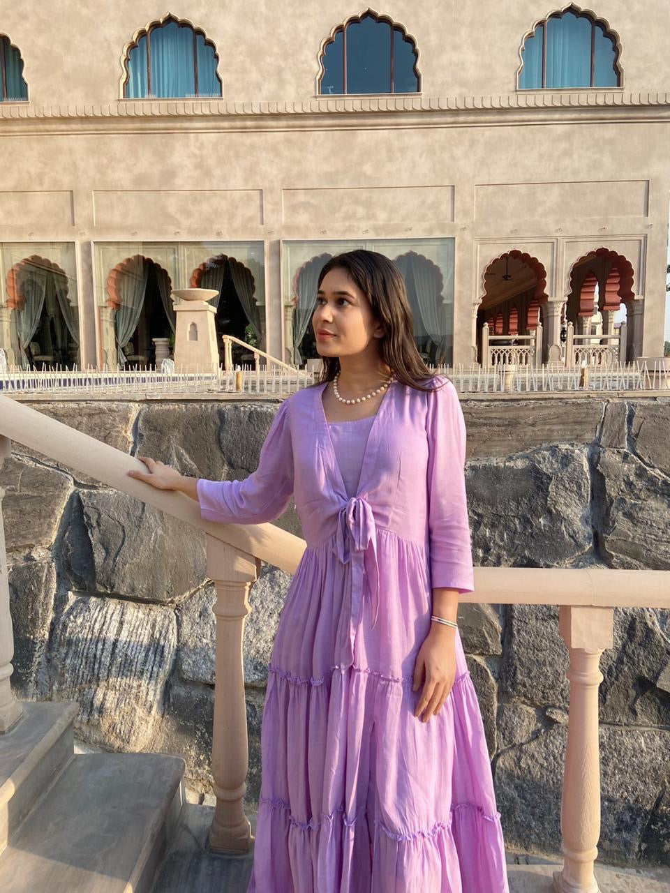 women's elegant long dress in lavender with a flowing tiered design and tied front detail