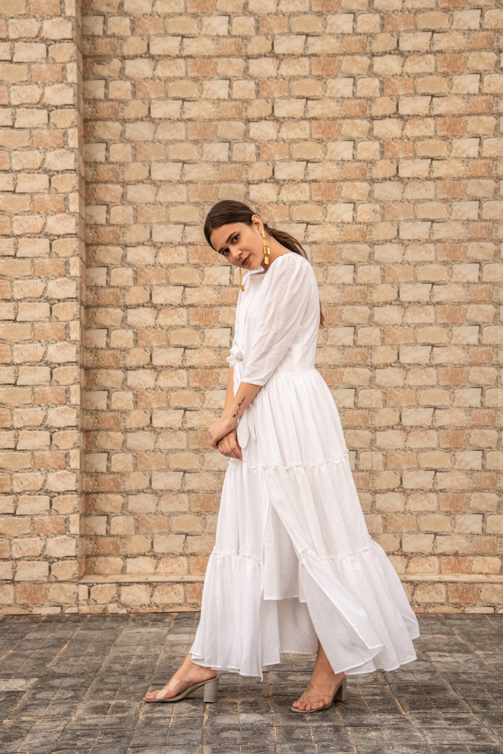 women's elegant long dress in white with tiered layers for a sophisticated look