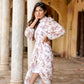 Model wearing a stylish women's floral dhoti style dress, showcasing flowing fabric and elegant design