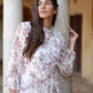 Model wearing a women's floral dhoti style dress, showcasing elegant floral patterns and flowing design