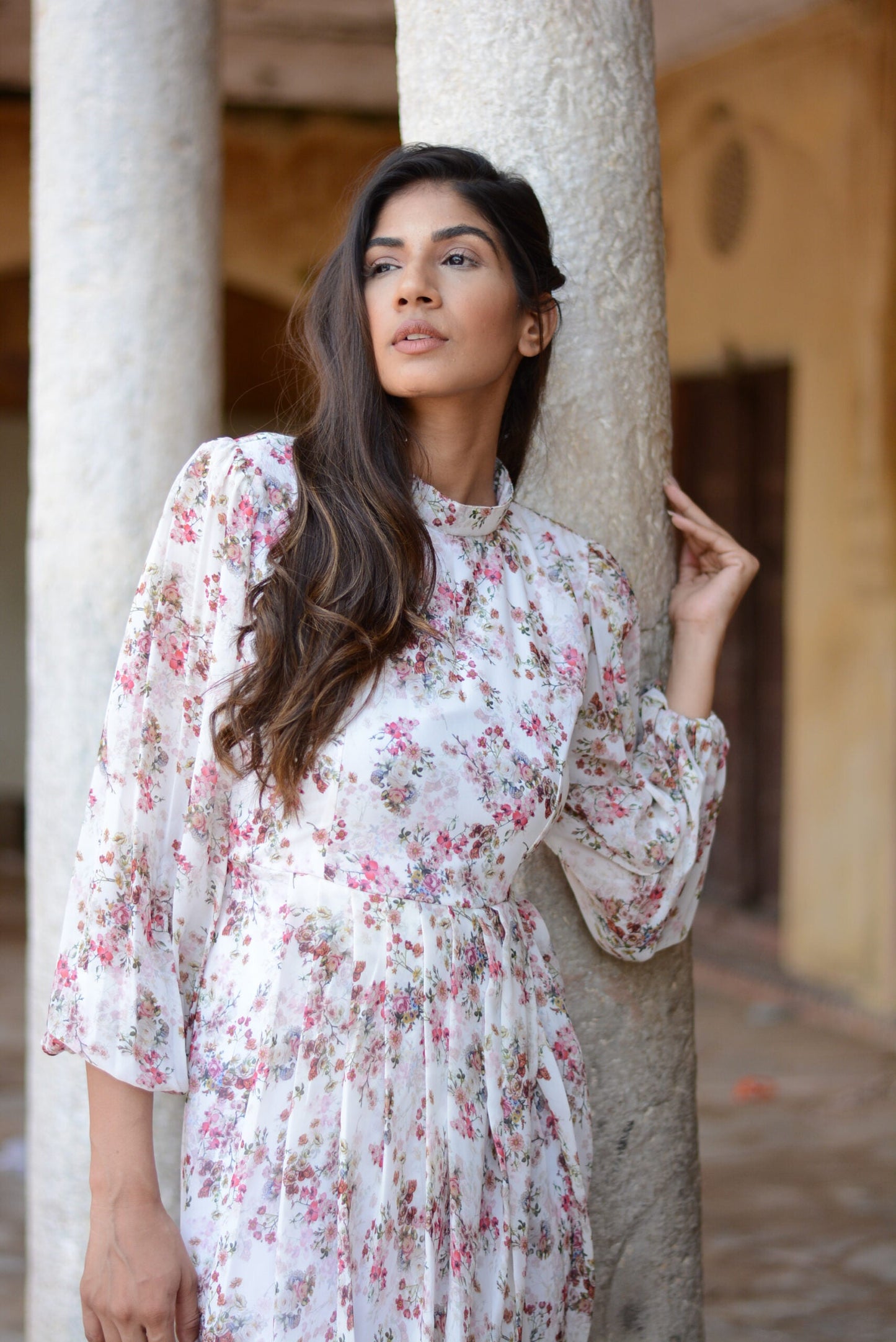 Model wearing a women's floral dhoti style dress, showcasing elegant floral patterns and flowing design