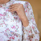 Women's floral dhoti style dress with elegant floral patterns and long puff sleeves