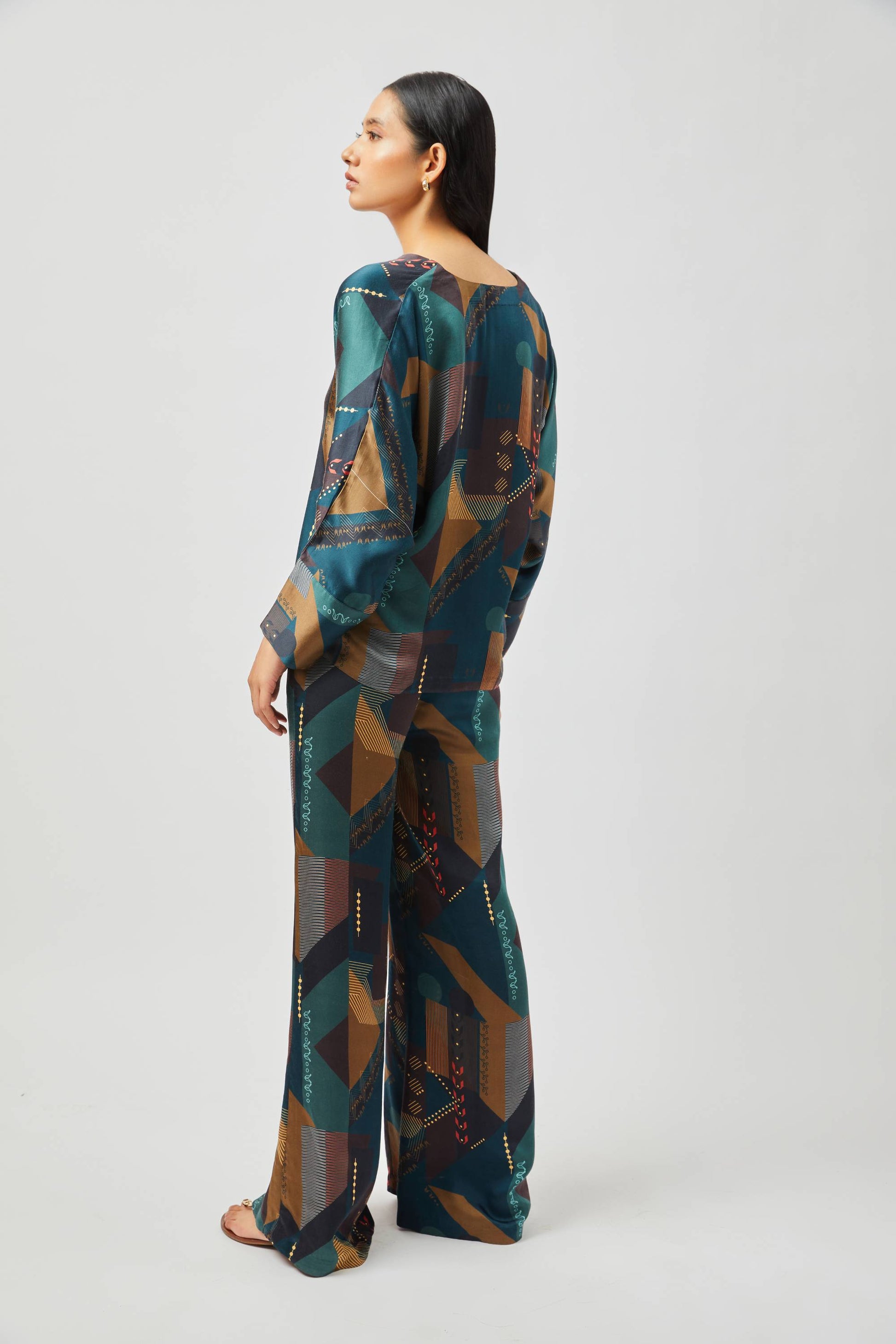 Stylera women's geometric print lounge set featuring long sleeves and wide-leg pants in blue and brown tones