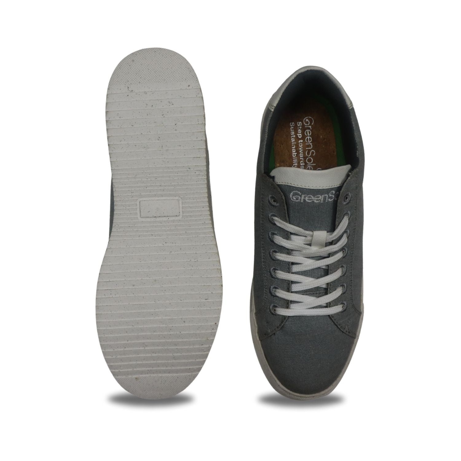 Top view of women's grey canvas sneakers by Stylera with white laces and rubber sole.