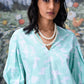 Stylera model wearing mint ikkat check dress V neck puff sleeves layered pearls women's ikkat check casual dress