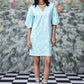 Stylera model in mint puff sleeve V neck women's ikkat check casual dress with lace up sandals and pearl necklace