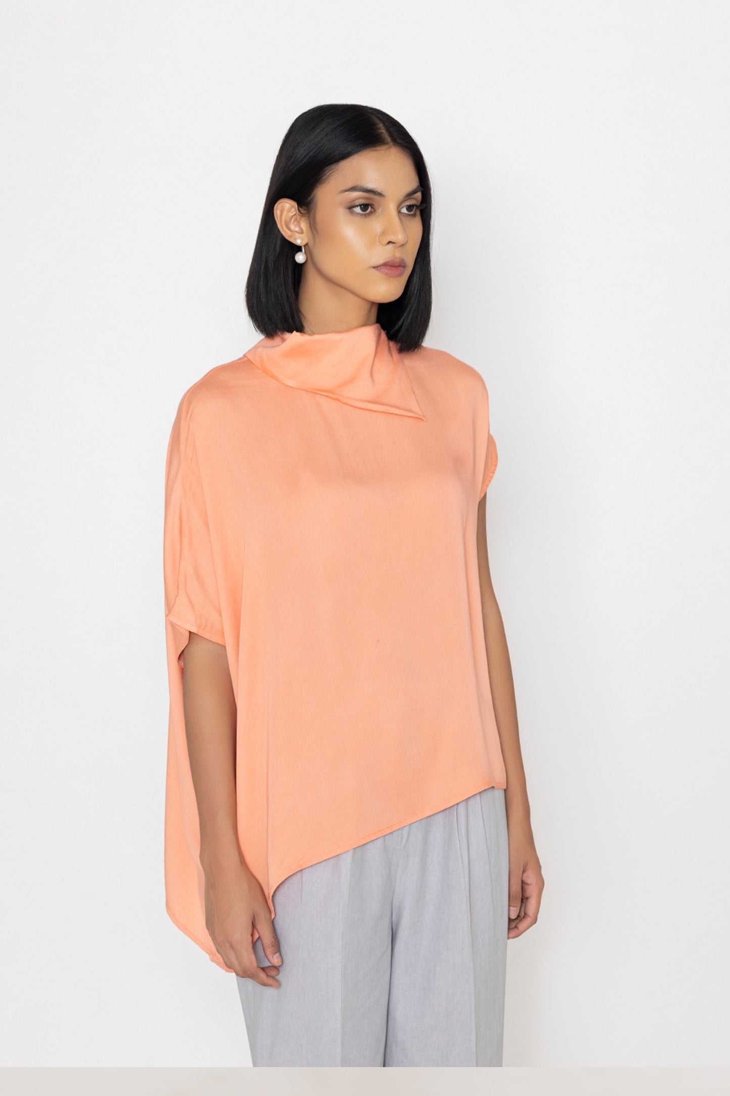 Stylera women's peach blouse with asymmetric hem and draped neckline in soft fabric