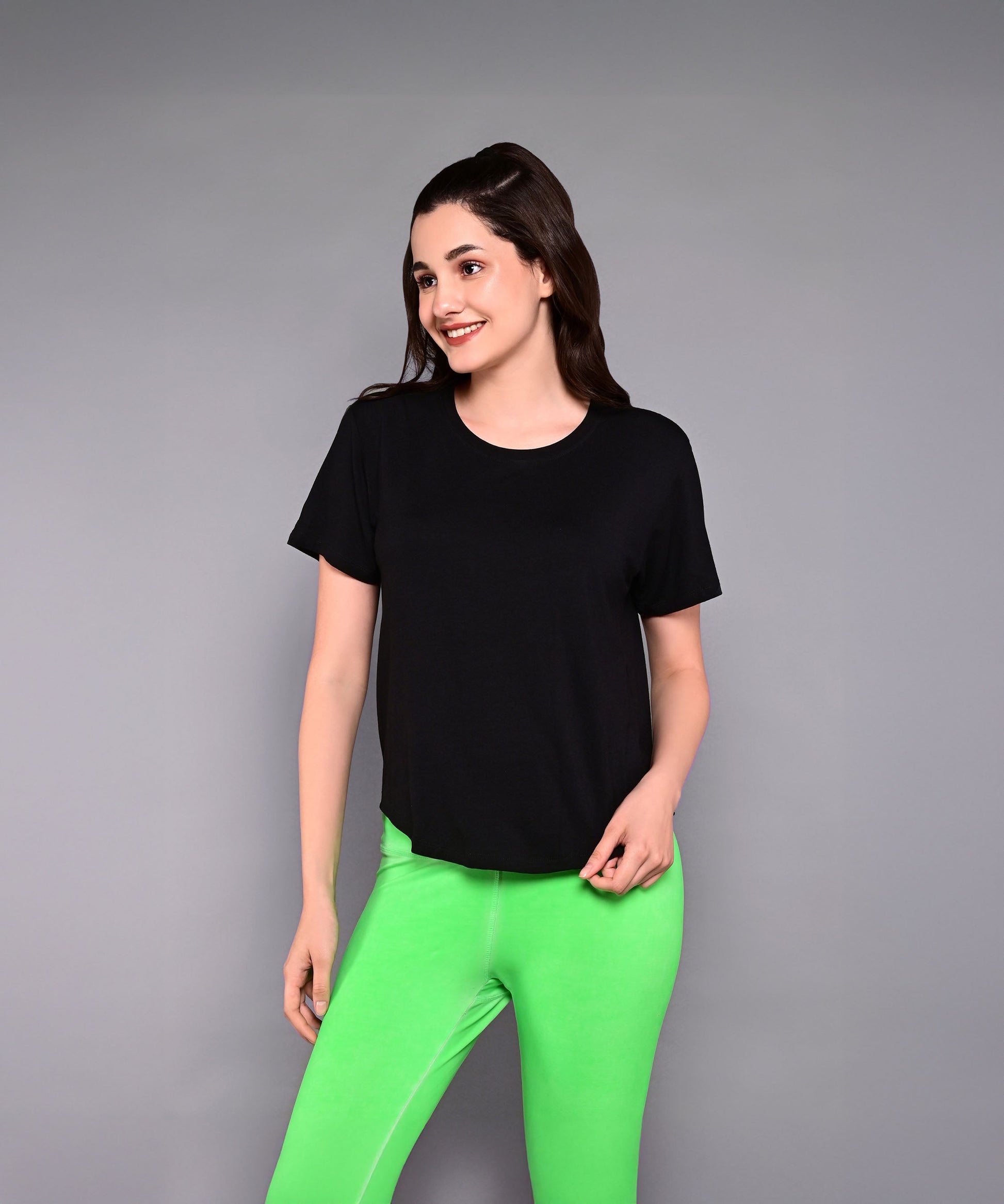 Black women's Pilates exercise top designed for comfort and flexibility during workouts