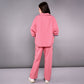 Back view of women's pink lounge set featuring relaxed fit jacket and matching pants