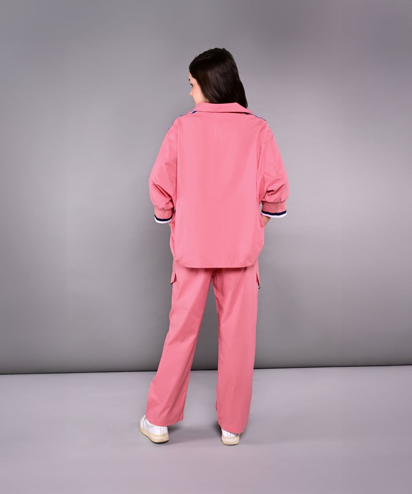 Back view of women's pink lounge set featuring relaxed fit jacket and matching pants