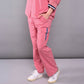 Women's pink lounge set featuring a relaxed shirt and comfortable pants for casual wear