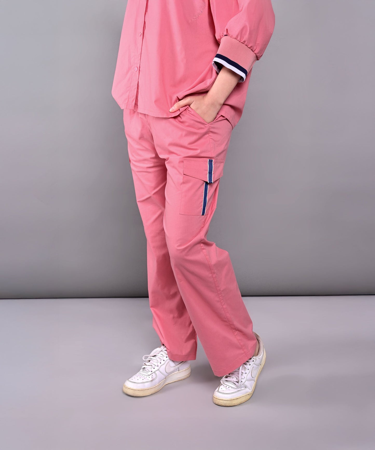 Women's pink lounge set featuring a relaxed shirt and comfortable pants for casual wear
