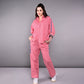 Women's pink lounge set featuring a relaxed fit top and matching pants with pockets