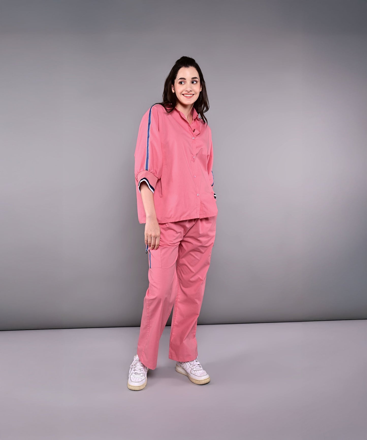 Stylish women's pink lounge set with comfortable fit and stylish side stripes