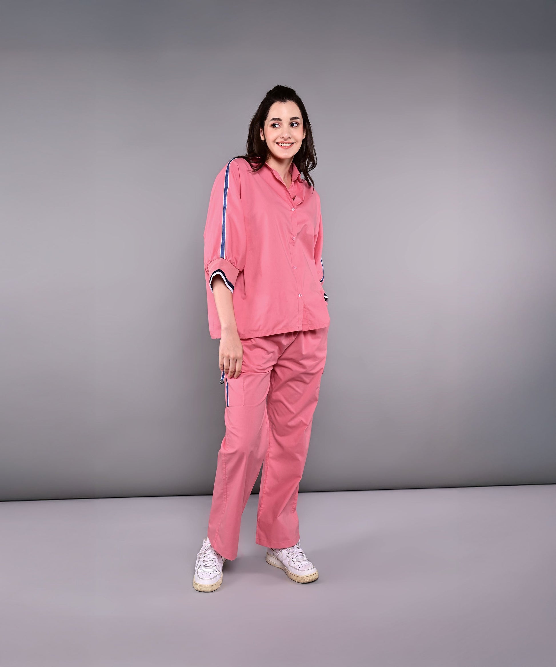 Stylish women's pink lounge set with comfortable fit and stylish side stripes