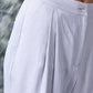 Close-up of women's regular fit linen pants in white by Stylera showcasing button and pocket details