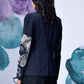 Back view of women's statement blazer for work by Stylera with floral sleeve design