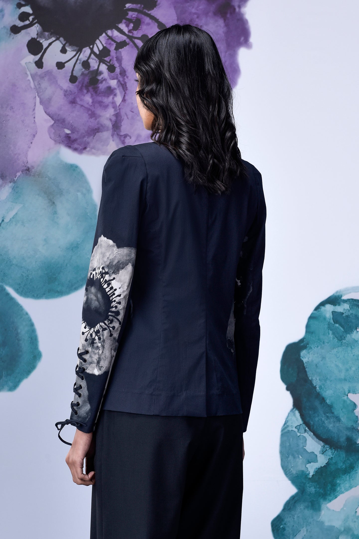 Back view of women's statement blazer for work by Stylera with floral sleeve design
