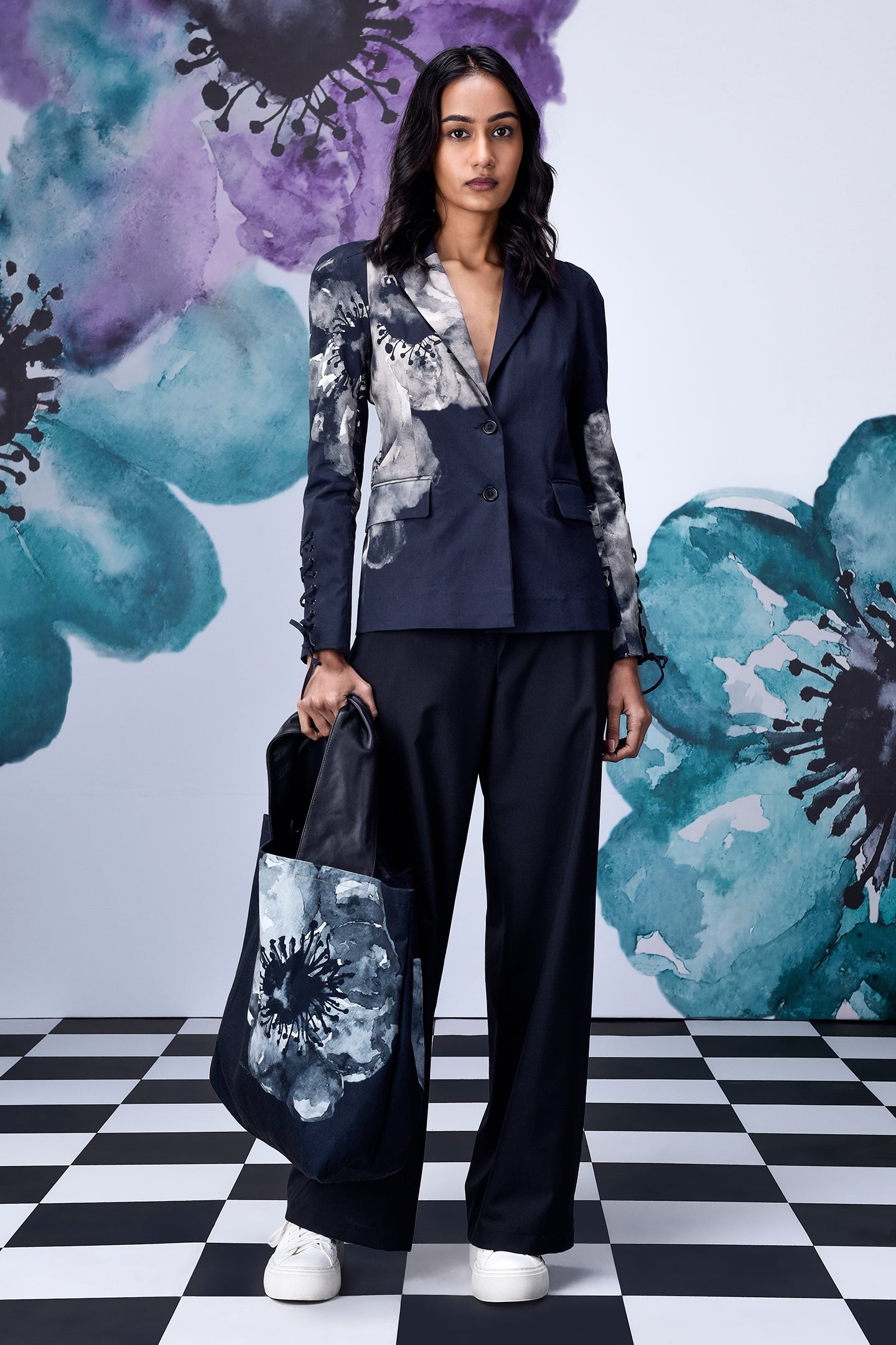 Stylera women's statement blazer for work in navy with floral print worn with matching pants and tote bag