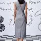 Back view of Stylera grey sleeveless sheath dress with back V and slit on model women's trendy wool dresses