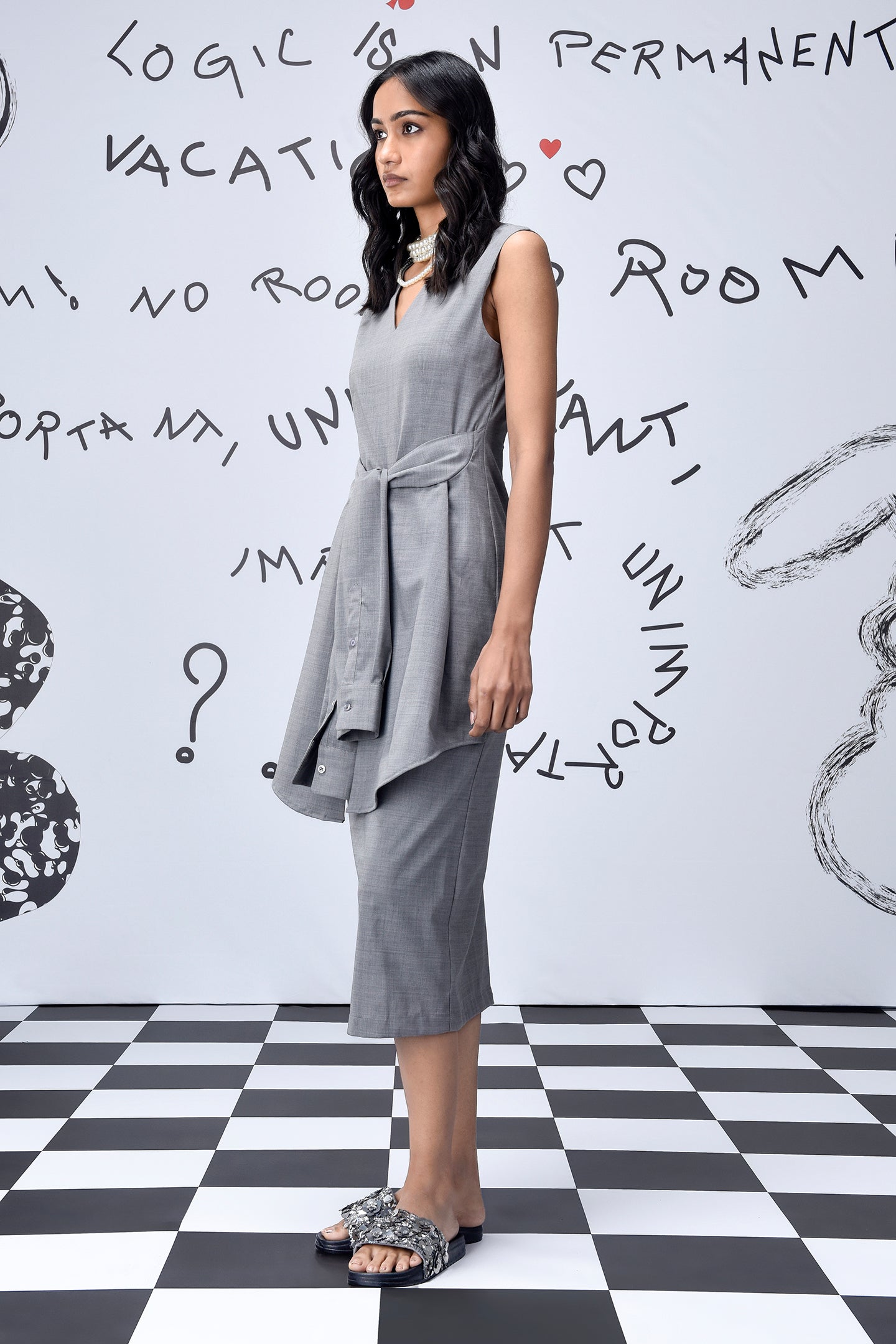 Stylera gray sleeveless midi dress with tie belt on model in studio women's trendy wool dresses