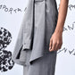 Stylera gray sleeveless wool dress with tied waist detail side view women's trendy wool dresses