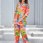 Colorful women’s tropical print co-ord set featuring vibrant floral patterns and a stylish top and pants combination