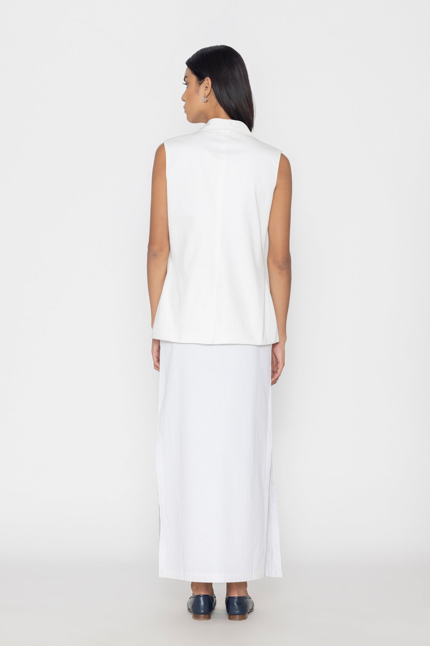 Stylera women's white sleeveless vest shown from the back with a high collar and relaxed fit