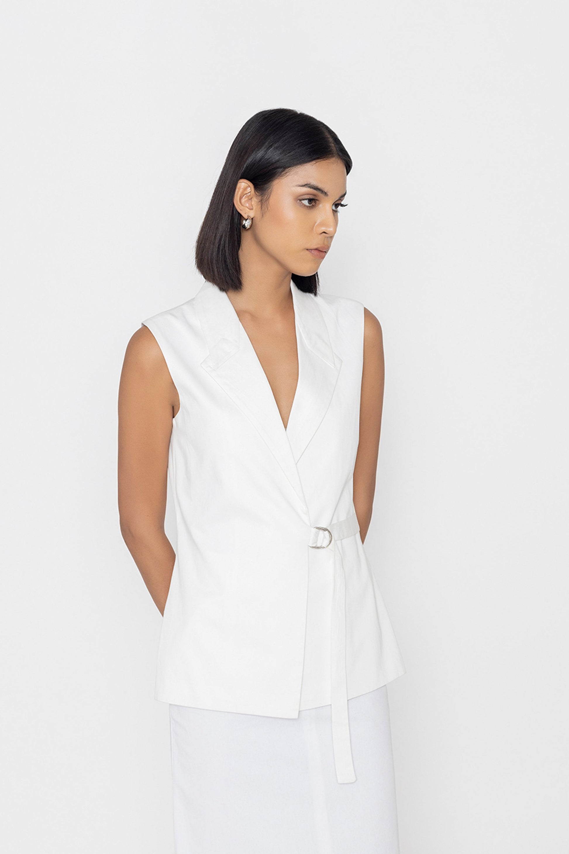 Stylera women's white sleeveless vest with a belted waist and deep V-neck design