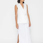 Stylera women's white sleeveless vest with side buckle and V-neck styled with long white skirt