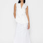 Stylera women's white sleeveless vest with wrap design worn with long white skirt and blue bandana