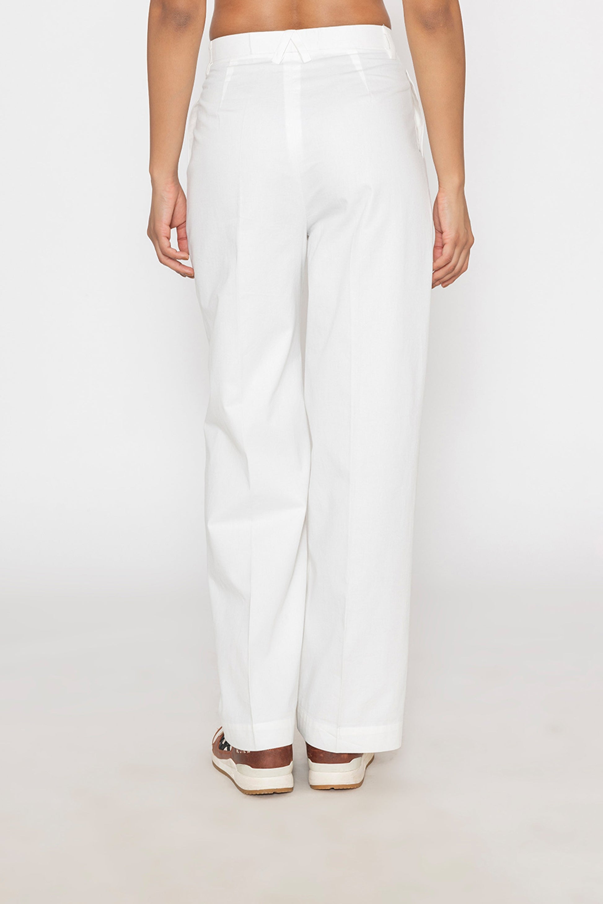 Stylera women's white wide leg trousers shown from the back with a relaxed fit and high waist