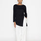Stylera women's white wide leg trousers paired with a black long sleeve top and headscarf
