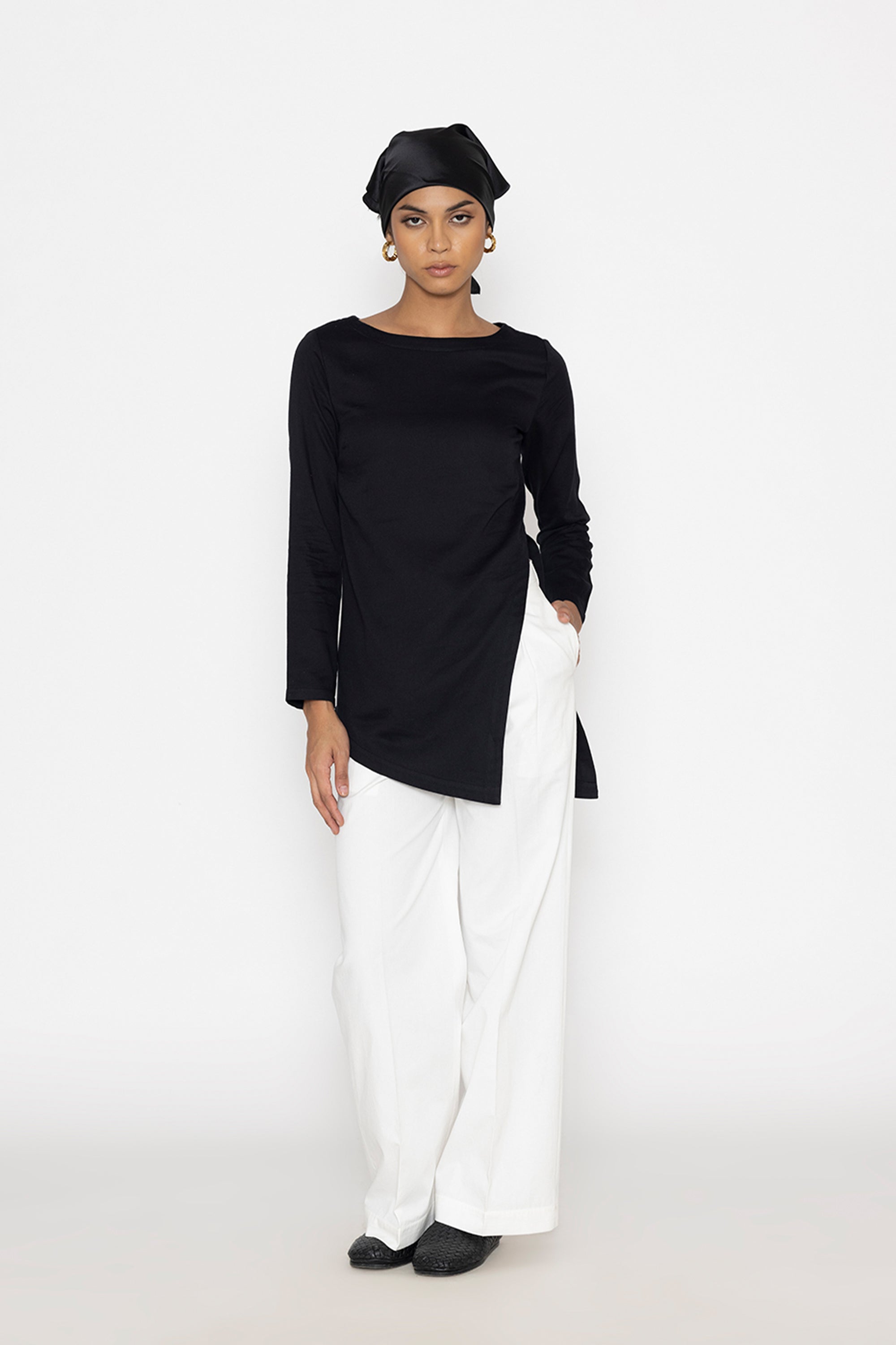 Stylera women's white wide leg trousers paired with a black long sleeve top and headscarf