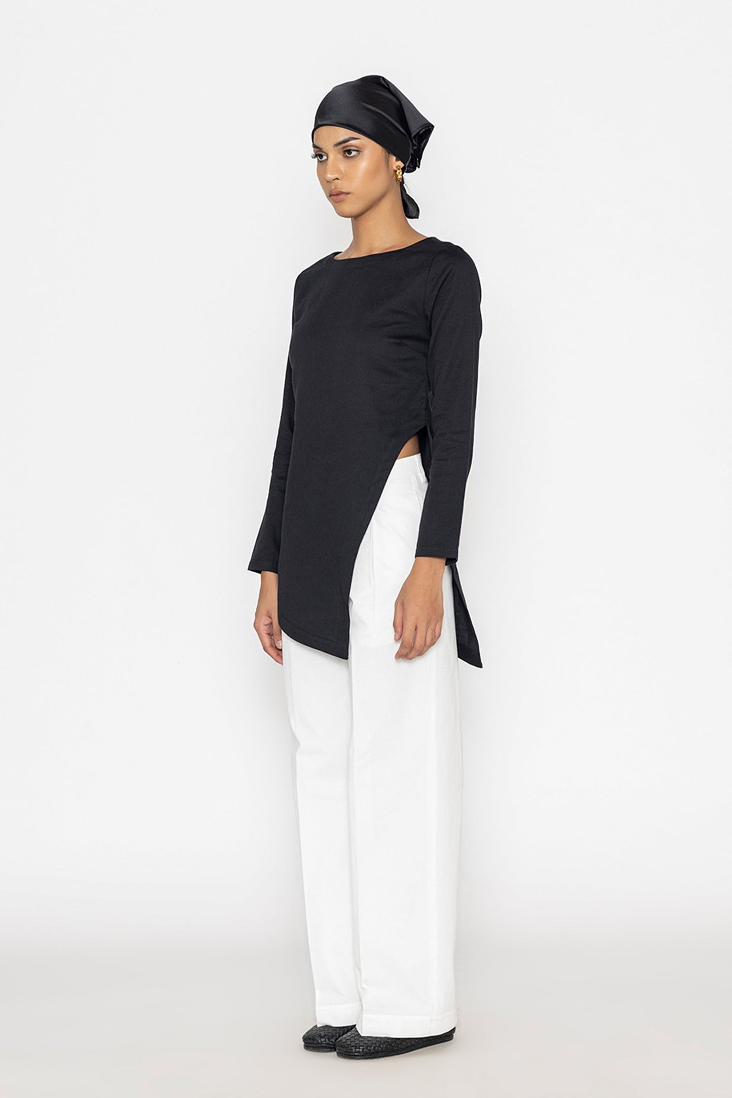 Stylera women's white wide leg trousers paired with black asymmetrical top and headscarf