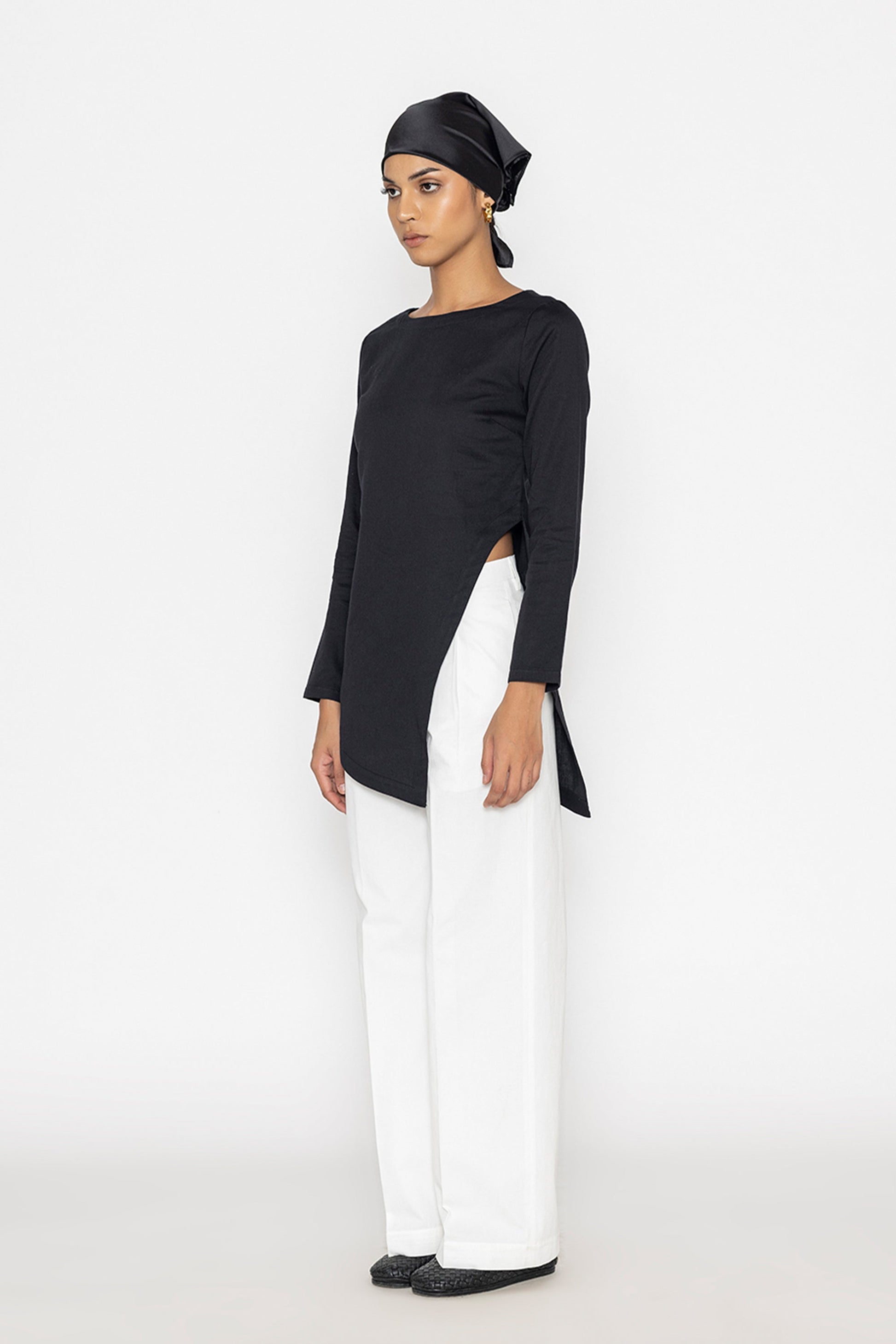 Stylera women's white wide leg trousers paired with black asymmetrical top and headscarf