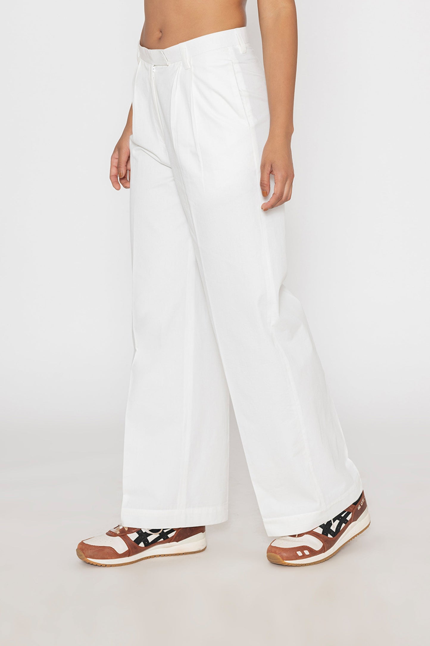 Stylera women's white wide leg trousers with a high waist styled with casual sneakers