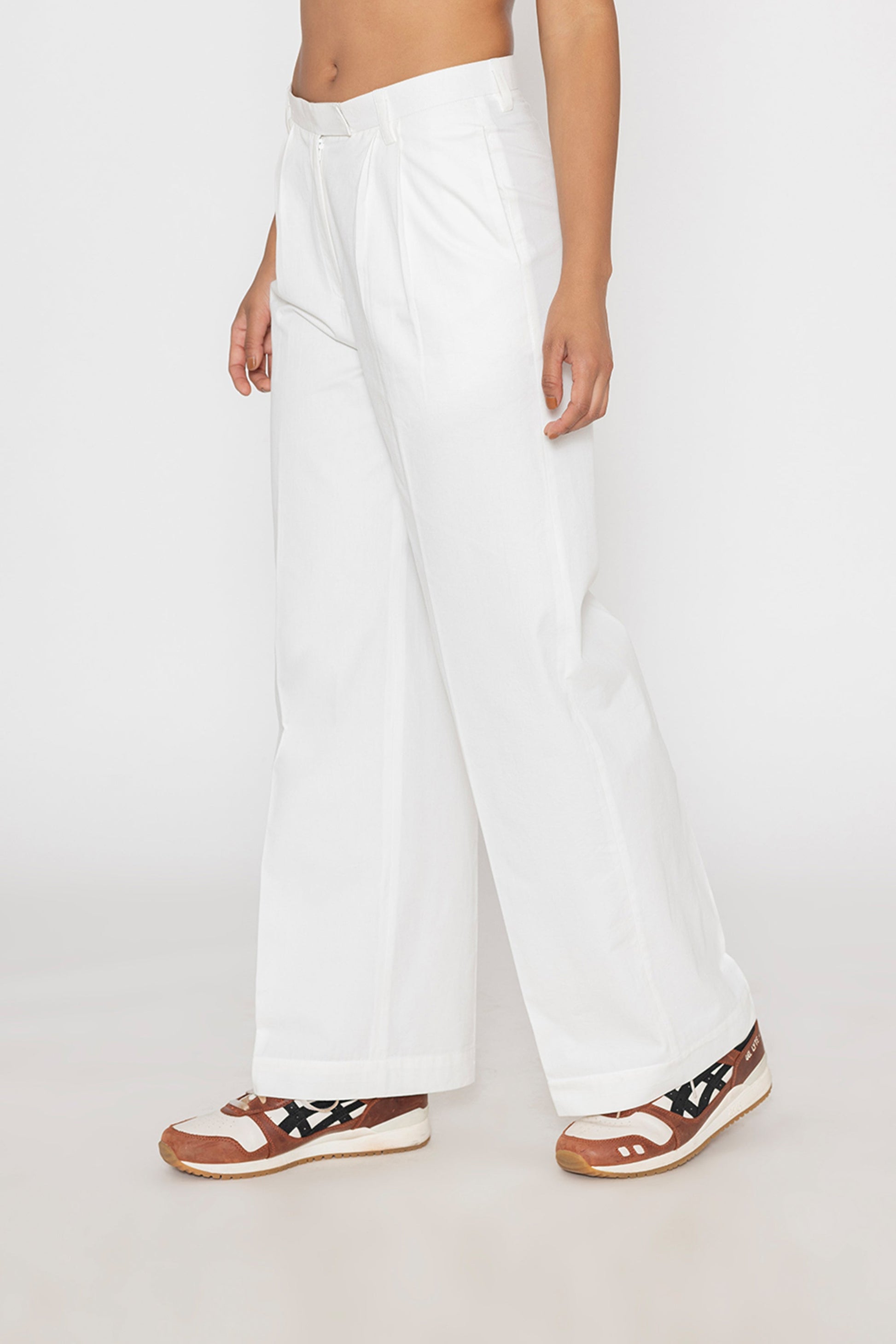 Stylera women's white wide leg trousers with a high waist styled with casual sneakers