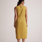 Stylera yellow draped midi dress shown from back on model with sleeveless design