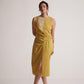 Stylera yellow draped midi dress with sleeveless design and front slit worn by model